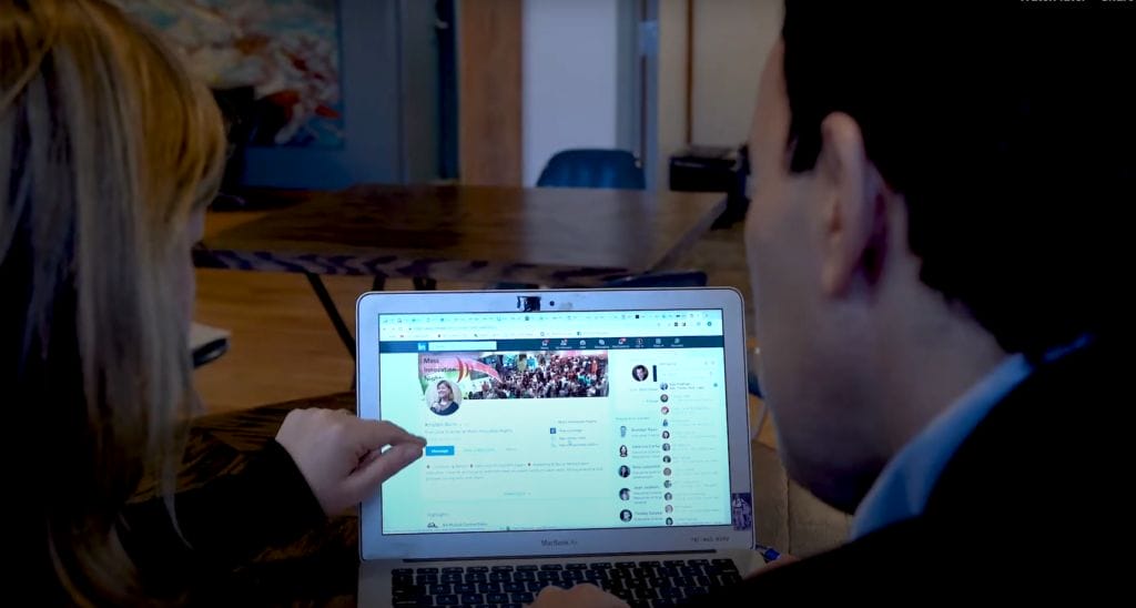Nick optimizing a LinkedIn profile with a client