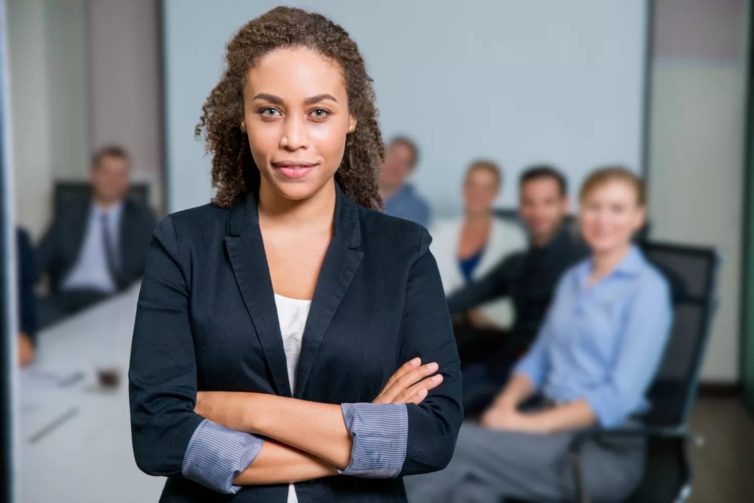 Women in a suit at a meeting